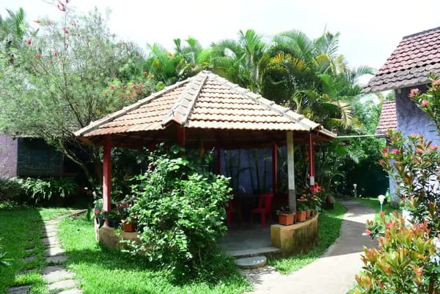A tiled octagonal gazebo standing in the garden